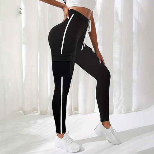 Kvinnors Sport Leggings med Sidofickor och Reflekterande Ränder – Andningsbart Tyg för Komfort och Säkerhet 1