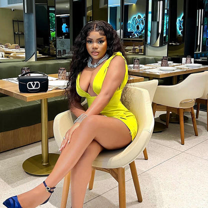 Svart Miniklänning med V-ringning och Fickor i Elastiskt Tyg – Bekväm och Elegant Klänning för Kvinnor 2