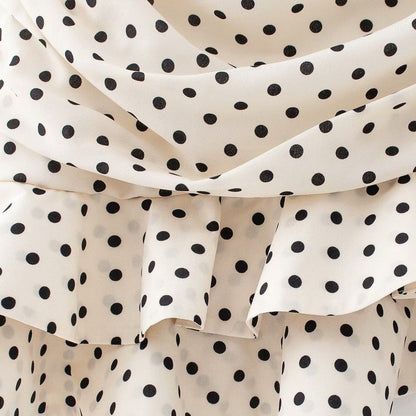 Vit Minikjol med Asymmetrisk Design och Volanger i Mjukt Material – Perfekt för Vardag och Fest 3